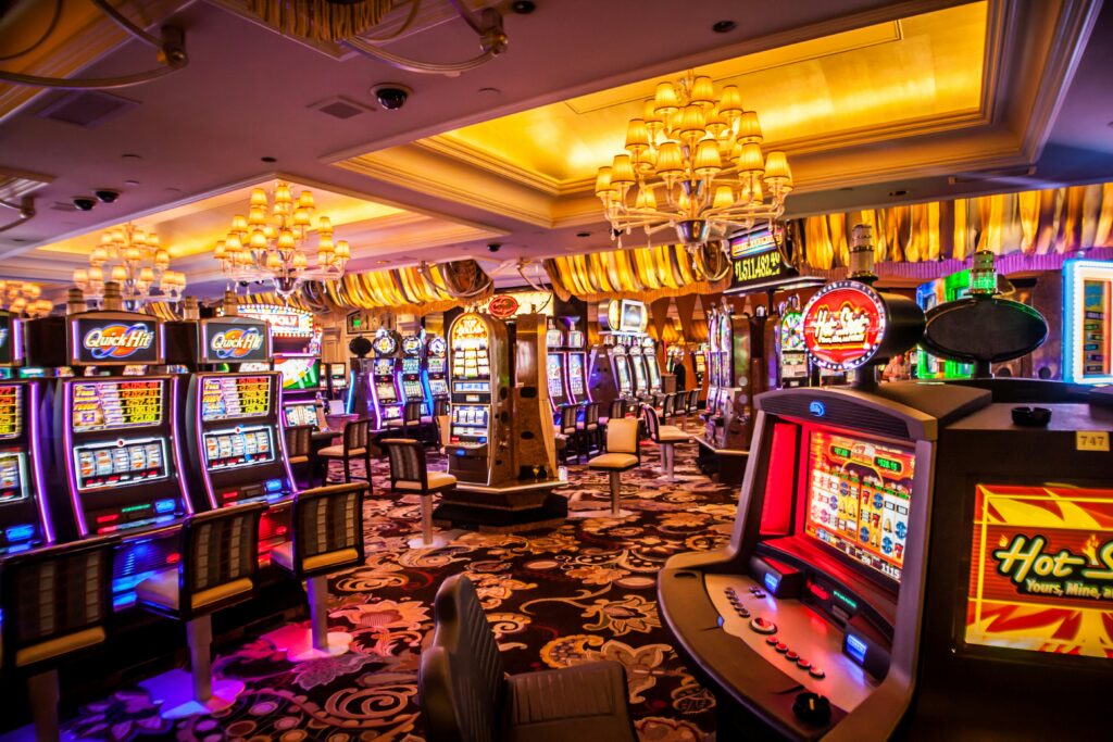 Arcade machine with lights turned on inside room – online casino gambling